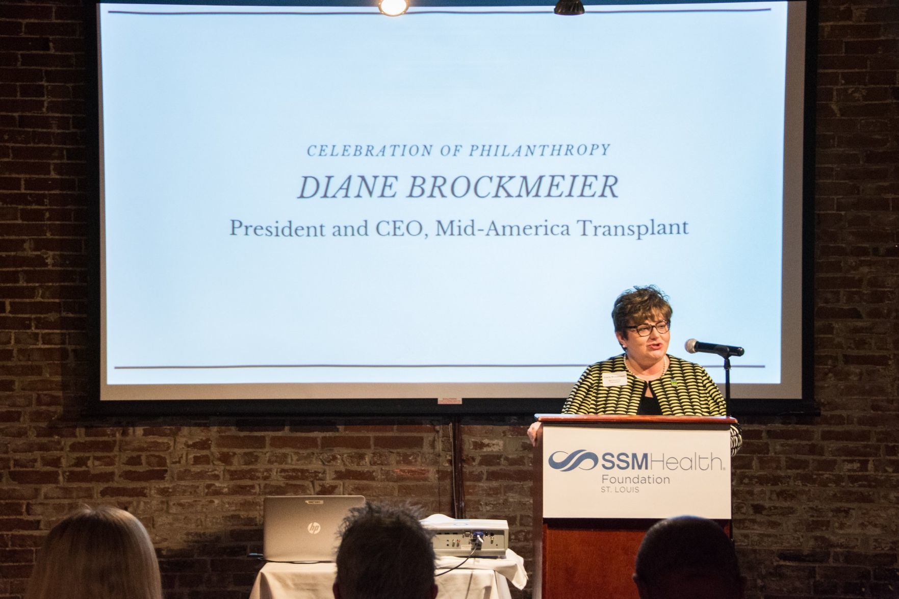 Diane Brockmeier, President and CEO of Mid-America Transplant speaks at the event